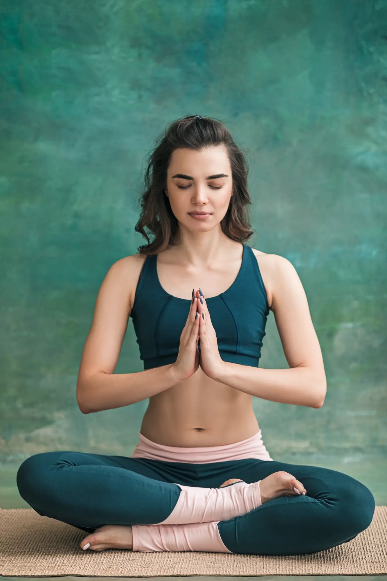 studio-shot-young-fit-woman-doing-yoga-exercises-green-space